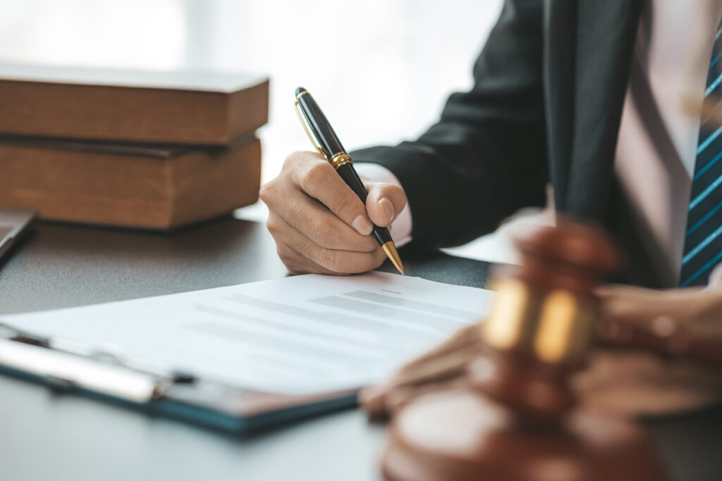 Attorney reviewing legal papers for lemon law case.