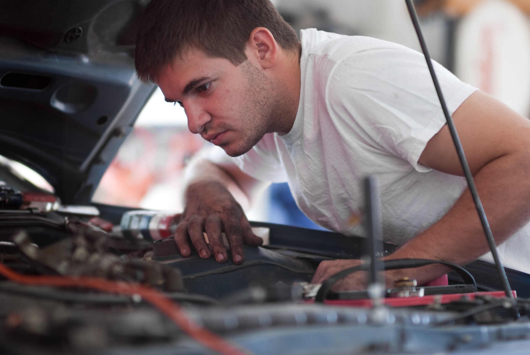 Man is checking defected car